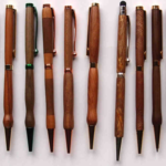 From left to right these Slimline pens are made from the following species of wood, with various finishes - Mahogany - Rimu - Black Rata - Rimu & Swamp Kauri - Tawa - Kauri - Rewa Rewa - Manuka - Tanekaha ( This normally white wood changed colour after having spent a long time under water in a dam from our local Waiteti stream ) - Red Manuka